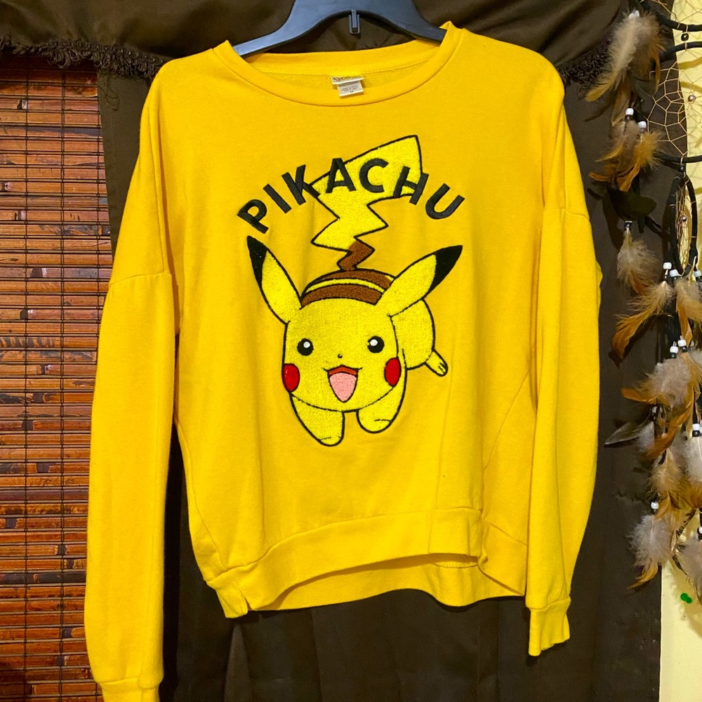 A yellow pikachu embroidered sweatshirt
